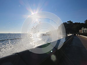 Sea Wall Dawlish looking out at sea in the sun