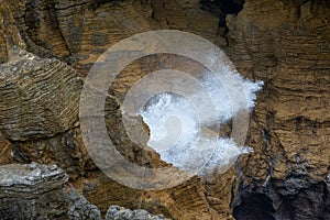 Sea water blowing out of a deep blowhole, Punakaiki