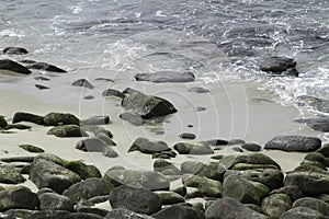 Sea Water Breaking on Rock Formations