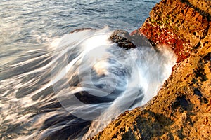 Sea water hits the rocks