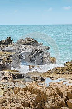 sea water hitting the rocks on the bay photo