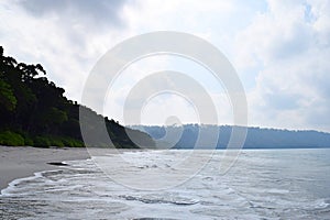 Sea Water, Peaceful Beach, Green Forest, and Open Sky - Natural Landscape at Radhanagar Beach, Andaman & Nicobar Islands, India