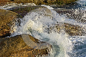 Sea water spalshing over the stones