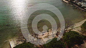 Sea water at springtime. Aerial top view of sandy beach and calm bay in spring