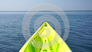 Sea water surface. Low angle view from kayak, camera flies over the clear green sea water. Nobody. Holiday recreation