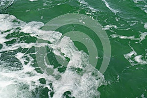 Sea water surface with splash, green ocean water