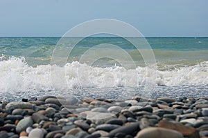 The Sea Wave of the Black Sea is a pebble beach. Smooth horizon, blue sky
