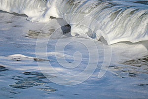 Sea wave with foam  closeup photo. Sea foam.