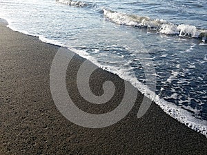 The sea wave hitting the shore is magnificent