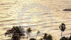 Sea wave or ocean seascape and beach scenic of Thailand, palm and coconut tree with sunrise light.