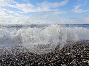 Sea wave on pebble beach