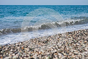 Sea wave on a pebbly beach