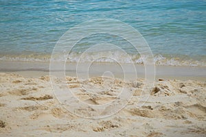 Sea wave rolling on beach shore