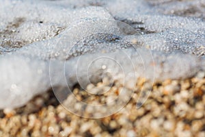 Sea wave rolling over the pebbles