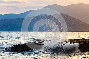 Sea wave splashing on rocks on shore close-up. Going to sea. Holiday time