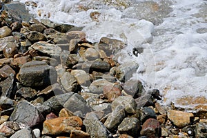 Sea wave and stone at the beach