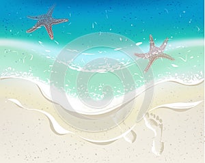 Sea wave on a tropical beach. Footprints on sand. Starfishes in