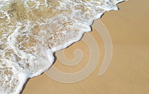 Sea wave, white foam, golden sand beach, turquoise ocean water close up, summer holidays border frame concept