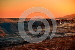 Sea waves background. Sunset over sea with golden dramatic sky panorama. Calm sea with sunset sky. Ocean and sky