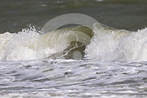 Sea waves at Ban Krut Beach in monsoon season