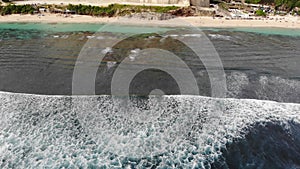 Sea waves and beach aerial view drone shot. Melasti beach, Bali