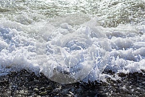 Sea waves on the beach. Selective focus. Summer nature background