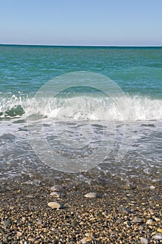 Sea waves on the beach. Selective focus. Summer nature background. vertical photo