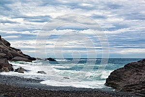 Sea waves break about the coast