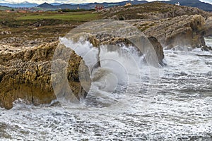 Sea waves breaking against the coast