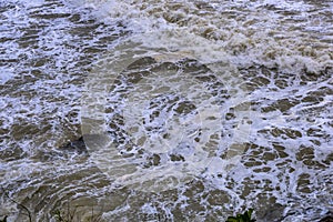 Sea waves breaking on a rocks. Deep blue sea waves hit cliff