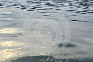 Sea with waves and clear sky calm water surface with small ripples