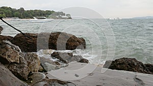 Sea waves crash against the rock