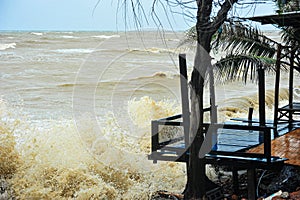 The sea waves crashed on the balcony of the house on the seashore