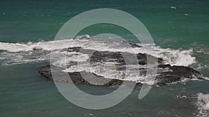 Sea waves crashing on a rock