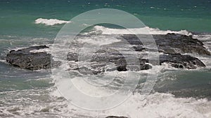 Sea waves crashing on a rock