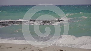 Sea waves crashing on a rock