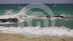 Sea waves crashing on a rock