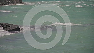 Sea waves crashing on a rock