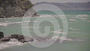 Sea waves crashing on a rock