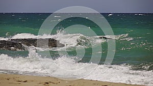 Sea waves crashing on a rock