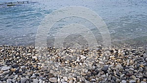 Sea waves dumping on pebble beach