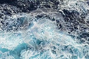 Sea waves and foam near cruise ship