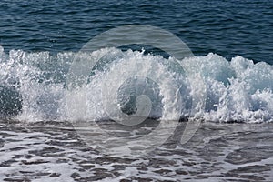 Sea waves with foam in top