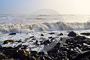 Sea Waves during High Tide at Rocky Shore on Sunny Day with Infinite Ocean - Seascape Natural Background