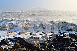 Sea Waves during High Tide at Rocky Shore on Sunny Day with Infinite Ocean - Seascape Natural Background - Indian Ocean