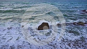 Sea Waves Hit Rocks and Stones with Splashes