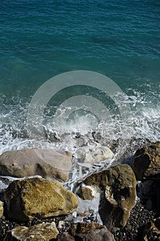 Sea waves hit stony seashore