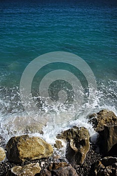 Sea waves hit stony seashore