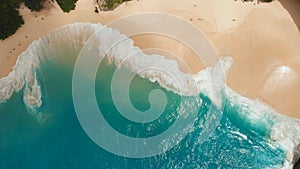 Sea waves Kelingking beach in Nusa Penida island, Bali, Indonesia. Drone view close up.