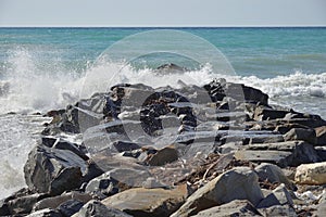 Sea waves lapping on rocky coast